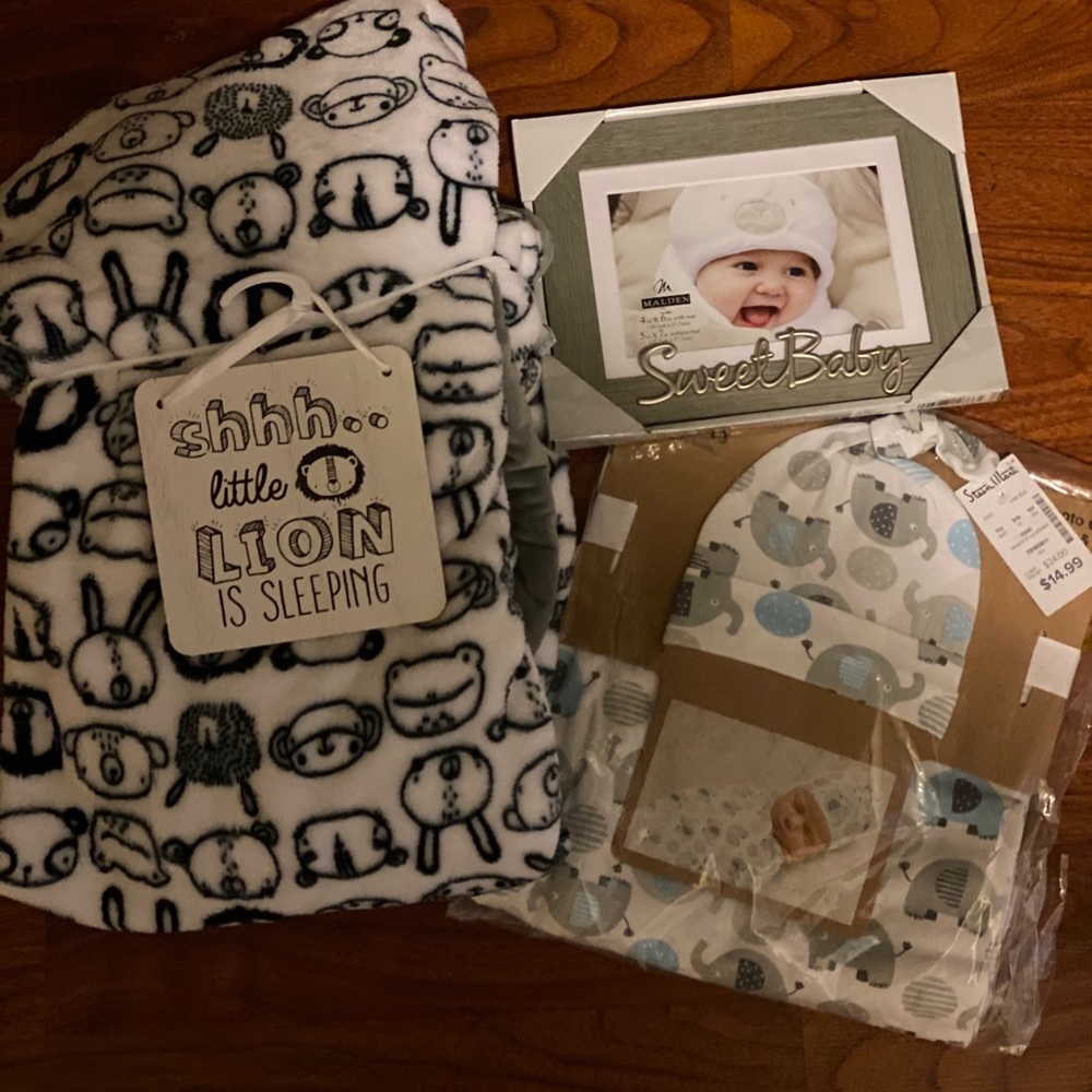 Baby blanket, frame, and baby swaddle